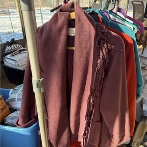 Good condition, has fringe-like collar, pockets, nice lining .